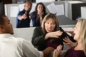 stock photo of misunderstanding  - Two female coworkers fight in office cubicle - JPG 