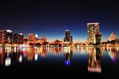 pic of urban  - Orlando downtown skyline panorama over Lake Eola at night with urban skyscrapers and clear sky - JPG 