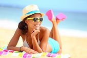 pic of holidays  - Beach woman funky happy and colorful wearing sunglasses and beach hat having summer fun during travel holidays vacation - JPG 
