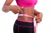 foto of fitness  - African American Fitness woman showing her belly isolated on white background - JPG 