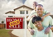 picture of black  - Happy African American Family in Front of New House and Sold Real Estate Sign - JPG 