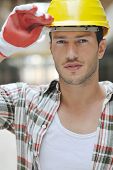 stock photo of construction worker  - handsome hard worker people portrait at concstruction site - JPG 