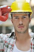 stock photo of construction worker  - handsome hard worker people portrait at concstruction site - JPG 