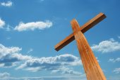 stock photo of religion  - High resolution christian cross made of wood over a beautiful sky background - JPG 