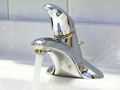 pic of seep  - Bathtub faucet on the sink with running water - JPG 
