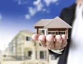 stock photo of investment  - house in human hands - JPG 