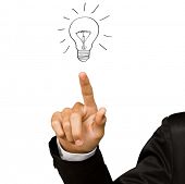 foto of science  - Business man hand drawing light bulb  isolated on white - JPG 