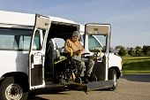 pic of transportation  - handicapped man operating a wheelchair lift van - JPG 