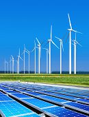 stock photo of generated  - environmentally benign solar panels and wind turbines generating electricity - JPG 