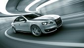 image of transportation  - 3d rendering of a brandless generic car of my own design in a tunnel with heavy motion blur - JPG 