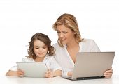 stock photo of future  - mother and daughter with laptop and tablet pc - JPG 