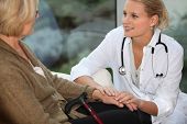 pic of medical doctors  - medical assistant taking care of senior woman - JPG 