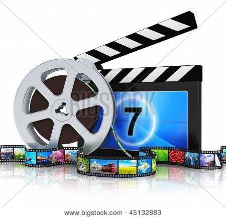 Picture or Photo of Cinema movie film and video media industry production concept: clapper board, metal film reel and filmstrip with colorful pictures isolated on white background with reflection effect