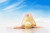 stock photo of beach  - young beautiful woman relaxing on beach - JPG 