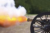 stock photo of discharge  - A close up shot of a Civil War cannon firing at a civil war re - JPG 