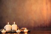 stock photo of zen  - Zen stones and aromatic candles on table - JPG 