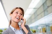 picture of talking  - Smiling businesswoman talking on mobile phone - JPG 