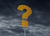 image of dilemma  - Direction dilemma with a group of yellow traffic road or highway signs in the shape of a question mark against a dark storm cloud background showing the danger and hazard of a decision in business or health - JPG 