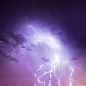 image of discharge  - Picture of discharge lightning in cloudy purple sky - JPG 