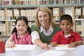 picture of education  - Two students in class with teacher - JPG 