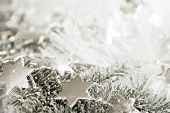 stock photo of glisten  - Silver sparkling stars on a white glistening background
 - JPG 