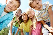 stock photo of youngster  - Portrait of happy kids outdoor looking at camera - JPG 