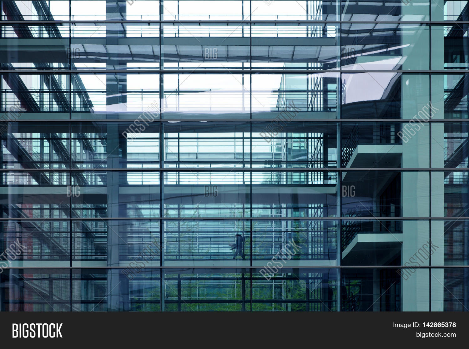the front facade of a modern multistory public building with glass the front facade of a modern multistory public building with glass