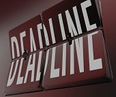 pic of time  - The word Deadline on flipping clock tiles to symbolize an end to a time periord or a countdown coming to its finish - JPG 