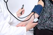 picture of pressure  - doctor measures the pressure of a woman - JPG 