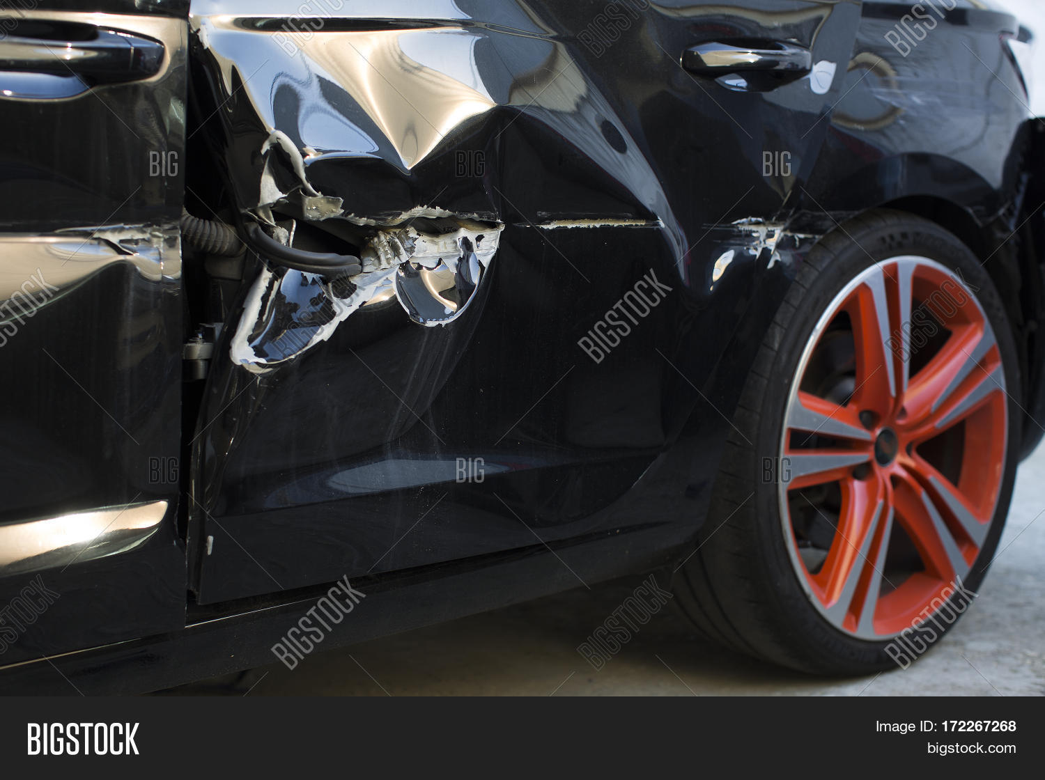 Damaged modern car, damaged car door. Damaged black car scratches on