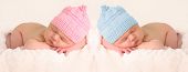 stock photo of infants  - Newborn babies in pink and girl knitted hats - JPG 