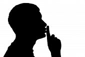 picture of quiet  - Male figure in silhouette gesturing for quiet - JPG 