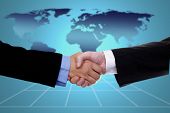 pic of handshake  - handshake over world map - JPG 