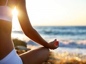 pic of beach  - body of a beautiful girl in a meditation on the beach - JPG 