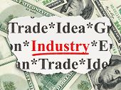 image of newspaper  - Torn newspaper with words industry on money background - JPG 