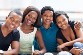 stock photo of outdoor  - closeup of group of african american college friends outdoors - JPG 
