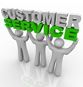 stock photo of customer  - Three customer service representatives lift the words - JPG 