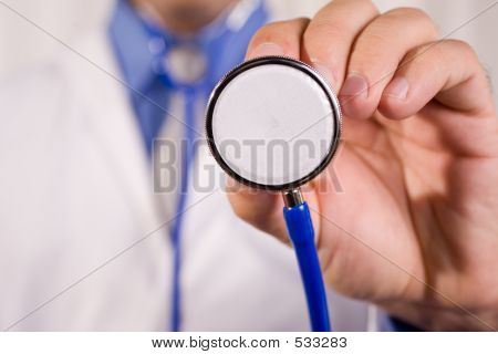 Picture or Photo of Man as medical doctor holding stethoscope.