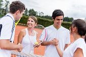 picture of handshake  - Group of tennis players giving a handshake after a match - JPG 