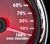 foto of percentage  - A red speedometer with a moving needle rising past numbers and percentages to hit 100 percent Goal Reached - JPG 