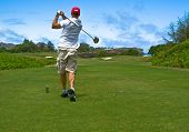 picture of golf  - Guy driving a golf ball on a golf course in Hawaii.
** Note: Slight graininess, best at smaller sizes - JPG 