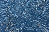 pic of glisten  - Blue ice cover on water glistening in the sun - JPG 