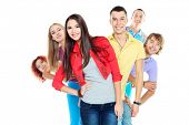 stock photo of group  - Large group of young people standing together in a row - JPG 