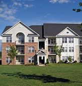 stock photo of buildings  - Facade of an upscale suburban apartment building - JPG 