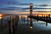 image of reflection  - Lighthouse at night in Austria  - JPG 
