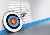 picture of teamwork  - Office scene one target and three arrows with different colors hitting the center conceptual image for achieving teamwork objective - JPG 