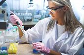 image of health  - beautiful woman working in modern laboratory - JPG 