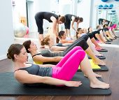 picture of group  - Aerobic Pilates personal trainer in a gym group class in a row - JPG 