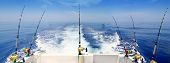pic of wake  - boat fishing trolling panoramic rod and reels blue sea wake - JPG 