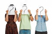 stock photo of people  - Three casual people standing in a line and holding questions marks isolated on white background - JPG 